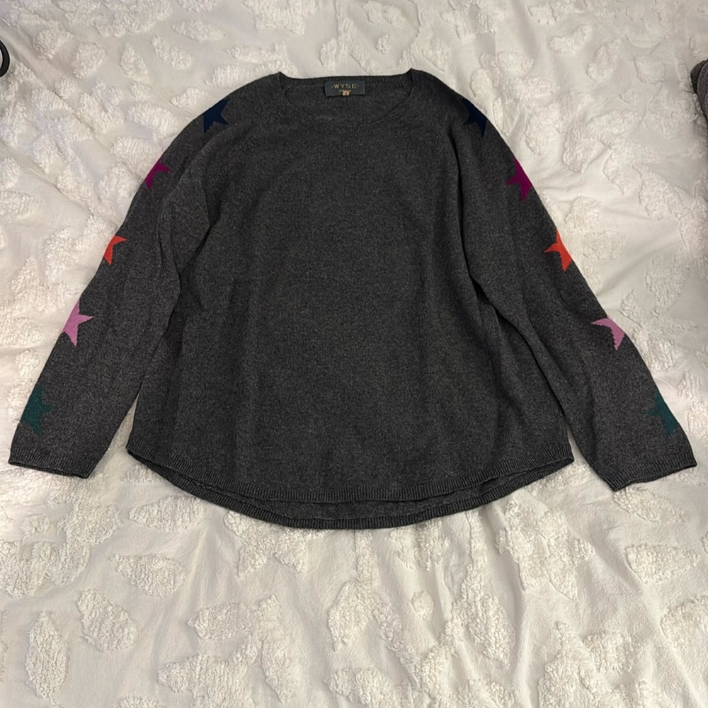 Gray sweater with colorful stars up both sleeves